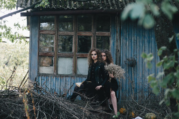 Two vintage witches gathered eve of Halloween