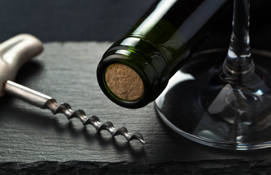 red wine bottle and corkscrew