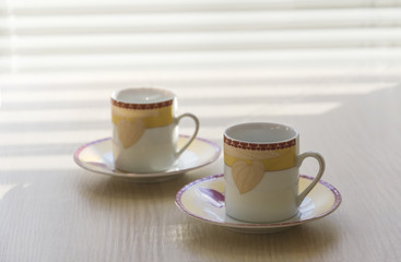 Two little coffee cups.