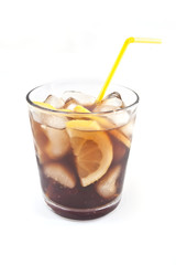 Cola with ice and lemon in a glass beaker