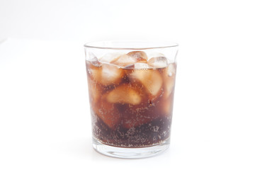 Cola with ice and lemon in a glass beaker