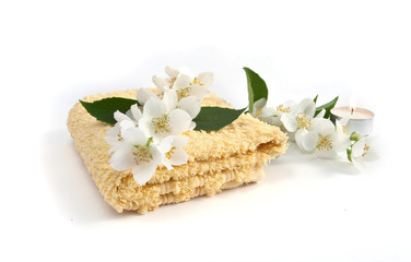 Fototapeta na wymiar fresh jasmine flowers and a towel on a white background