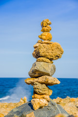 Fototapeta na wymiar Stack of stones on sea shore, Aruba