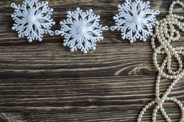 Snowflakes border on wooden background
