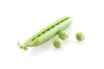 fresh green peas isolated on white