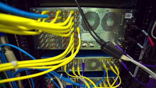 Back Side Of Modern Working Data Center Servers With Yellow Cable - Cloud Service And E-Commerce, Upload And Download Server - Tilt Up