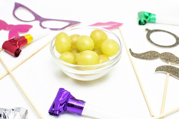 Twelve grapes and utensils for New Year's holiday