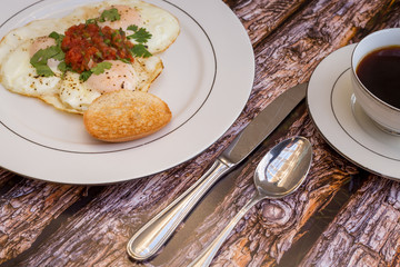 Over-easy eggs with fresh slasa and coffee