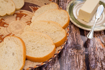 Freshly sliced bread platter with butter.