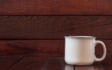 colorful cups on the wooden background
