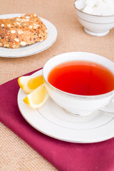 Breakfast with pastries, and hot tea with lemon.