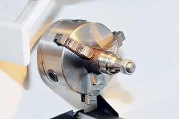 Spindle and a clamping mechanism for turning lathe.