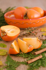 Slices of persimmon on a leaves