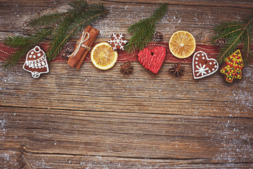 Christmas  wooden background with Christmas cookies and cinnamon