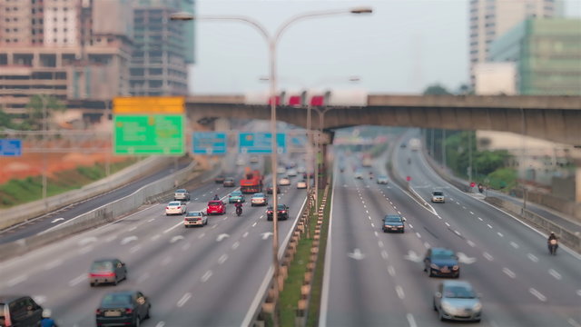 4k footage of traffic time lapse at Kuala Lumpur during sunrise. Tilt shift effect.