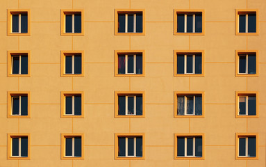 Regular pattern of windows in modern residential building