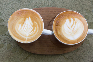 Close up cup of Coffee latte on the wood table