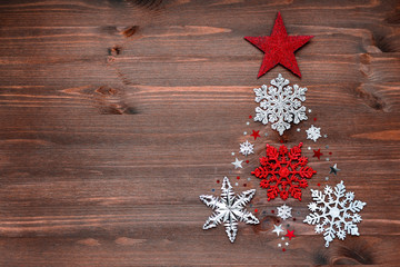 Christmas background with new year decorations in shape of fir-tree. Place for your text.