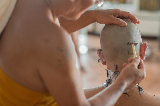 Buddhist monks shave their hair to be ordained a priest