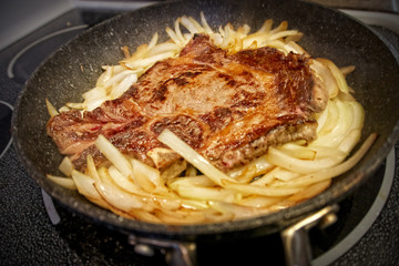 home cooking grilled beef steak with onion