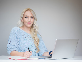 young beautiful woman using a laptop computer at home