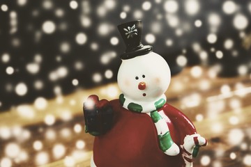 Christmas background with snowman and snow, vintage style
