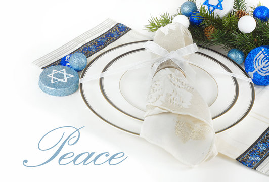 Place setting with blue and white Hebrew symbols for Hanukkah