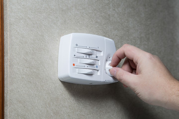 Hand setting a thermostat