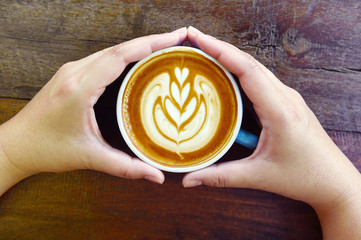 a cup of latte art coffee.