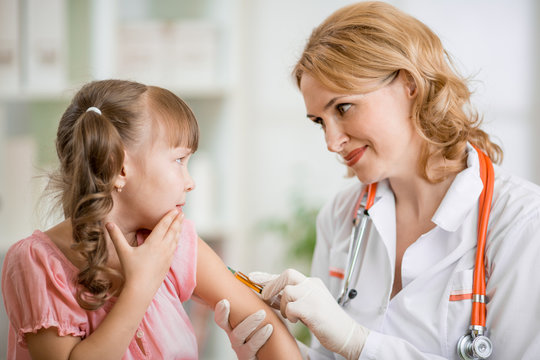 doctor vaccinating frightened preschool child