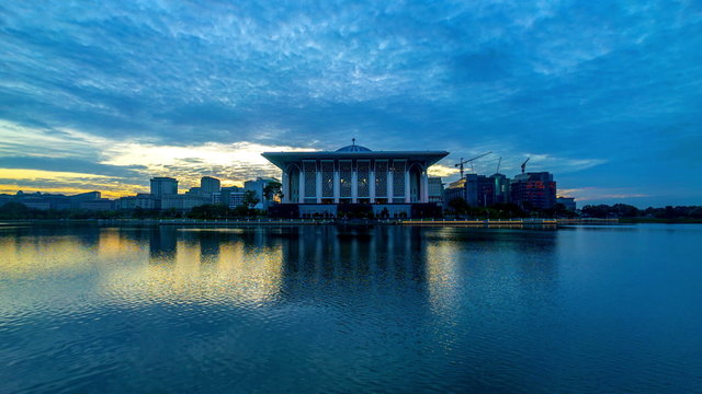 Time lapse 4k Footage of Epic Sunrise At Iron Mosque (Masjid Tuanku Mizan Zainal Abidin), Putrajaya. Showing a moving and changing color clouds. Panning