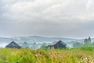 Summer rural landscape with old houses