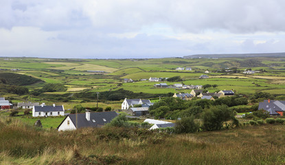 Rural farmhouses among farmland.
