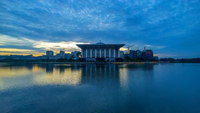 Time lapse 4k Footage of Epic Sunrise At Iron Mosque (Masjid Tuanku Mizan Zainal Abidin), Putrajaya. Showing a moving and changing color clouds. Zoom in.