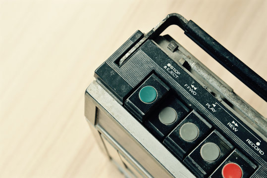 Dusty old radio with one cassette player , press forward