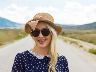 young woman walking on a long deserted road