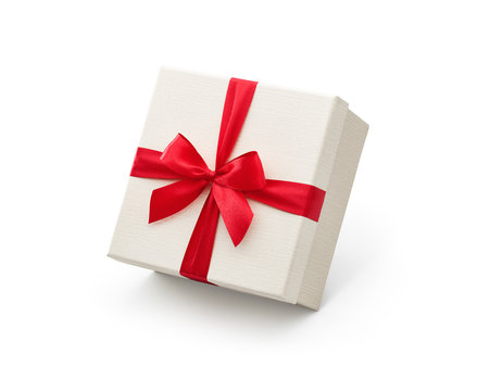 White gift box with red bow isolated on white background - Clipping path included