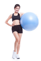 Young woman doing exercises with fitness ball 