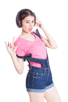 Young Woman Listening To Music And Dancing On White Background