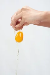 Keuken spatwand met foto pouring egg white background © nathadech