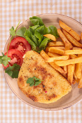 breaded meat and french fries