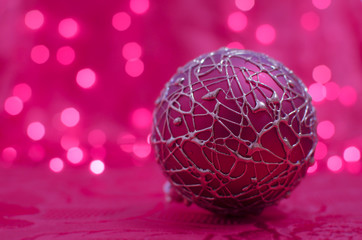 Pink christmas ball on bokeh background