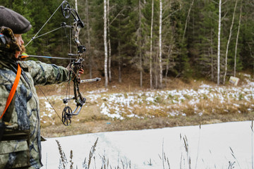 archery man archer  aiming  shooting  target  outdoors