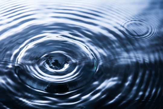 Abstract deep blue circle water drop ripple. Liquid texture background.