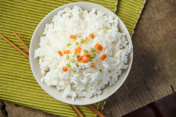 Jasmine rice with chopsticks on a fabric mat