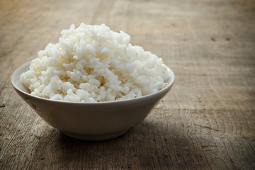 Jasmine rice isolated on wooden table