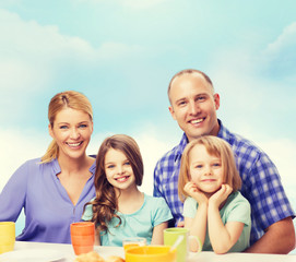 happy family with two kids with having breakfast