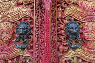 ancient door with  doorknob lion