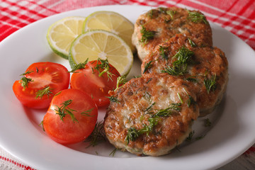 Cutlets from white fish fillets with herbs close-up. horizontal

