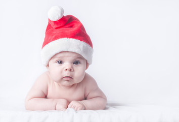 Cute Baby Girl in Red Santa Hat on Clean Wintry Background